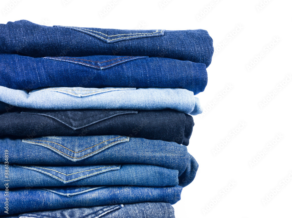 jeans stacked on white background blank for design and text input.