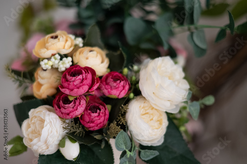 Bright bouquet of roses  peonies and buttercups floral background