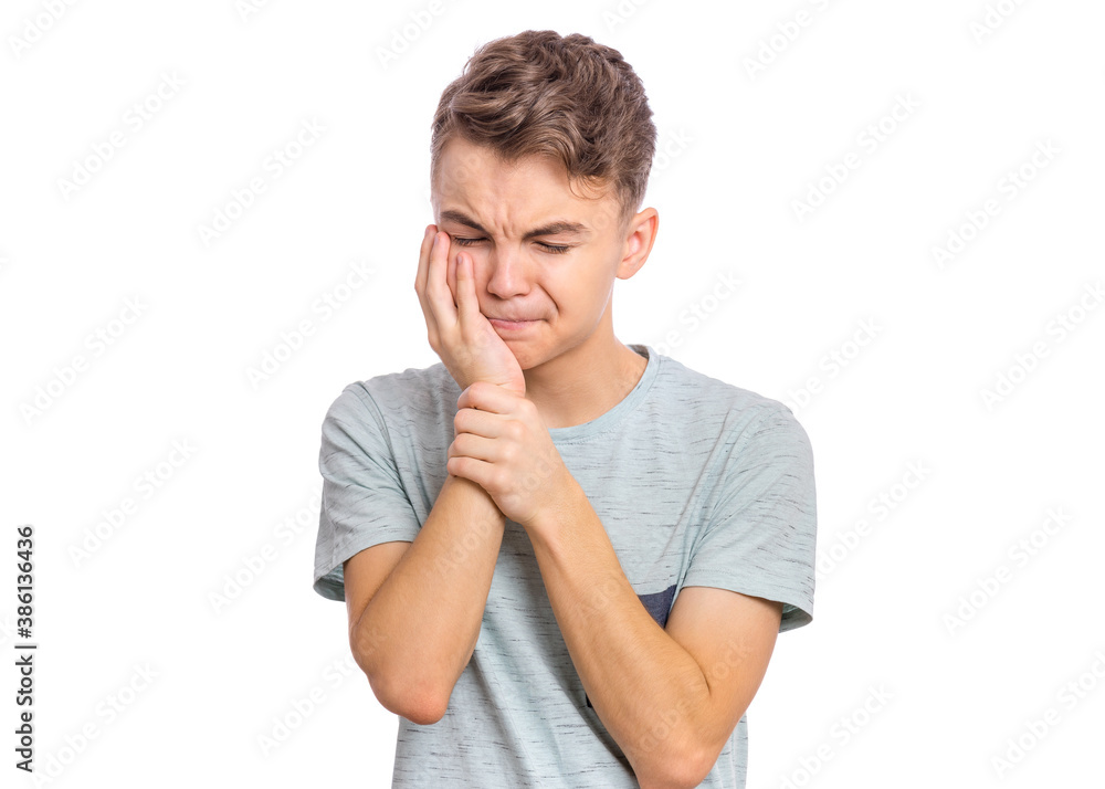 Handsome sad teen boy with tooth pain, isolated on white background Handsome sad teen boy with tooth pain, isolated on white background