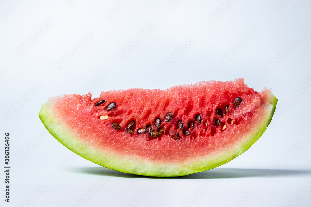 Watermelon on a white background. Cut off a slice of watermelon. Red ripe watermelon Watermelon on a white background. Cut off a slice of watermelon. Red ripe watermelon