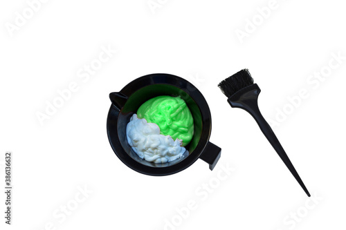 Mixing hair dye in a special plastic bowl. Concept is hair coloring. Isolated on white.