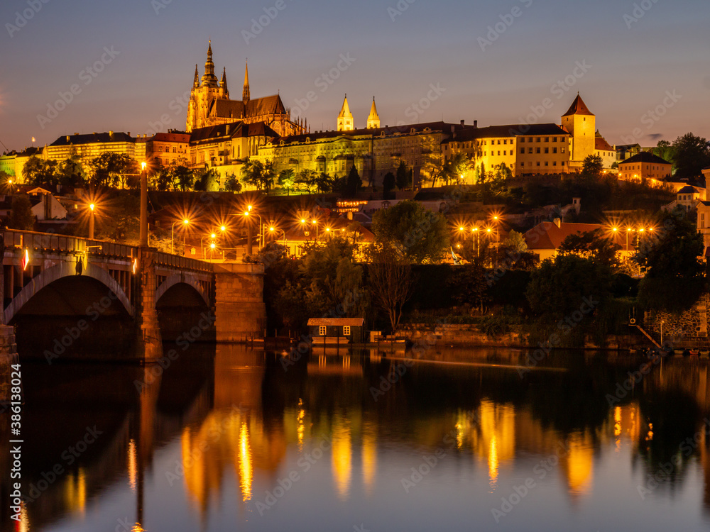 Prague castle across the Vltava river in the evening light