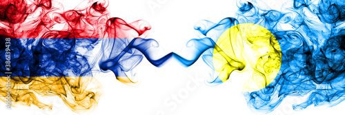 Armenia vs Palau smoky mystic flags placed side by side. Thick colored silky abstract smoke flags