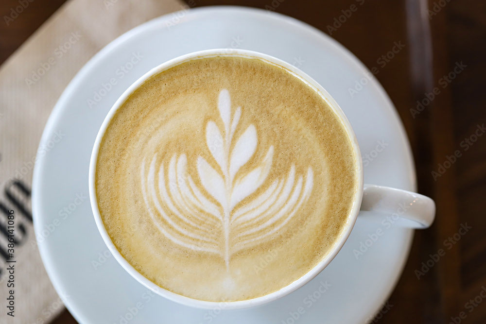 cup of latte art coffee on wooden background cup of latte art coffee on wooden background
