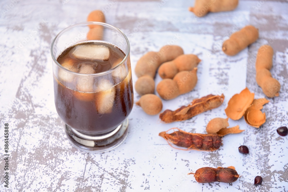Tamarind juice, ripe tamarind fruit and seeds Tamarind juice, ripe tamarind fruit and seeds