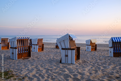 Fototapeta Naklejka Na Ścianę i Meble -  Rows of Strandkorb beach-chairs for hire at the baltic sea in usedom, germany