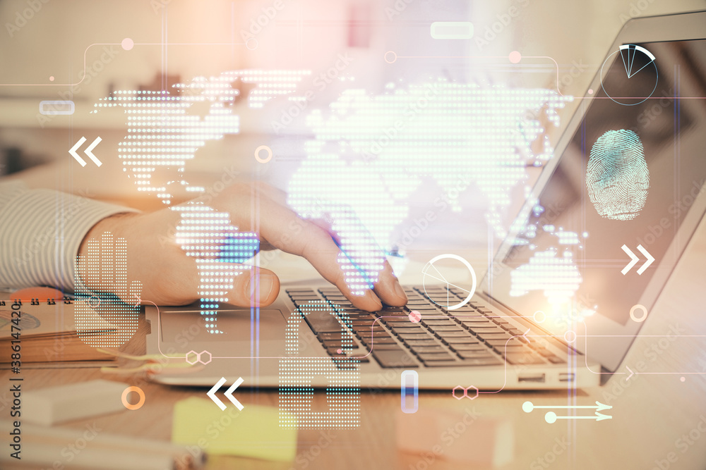 Multi exposure of world map hologram with man working on computer on background. Concept of worldwideweb. Multi exposure of world map hologram with man working on computer on background. Concept of worldwideweb.