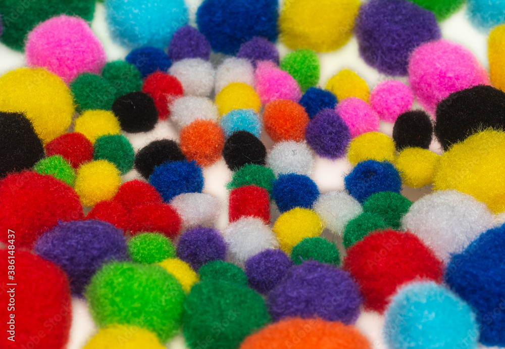 Fluffy rainbow coton balls. Multicolored background. Fluffy rainbow coton balls. Multicolored background.