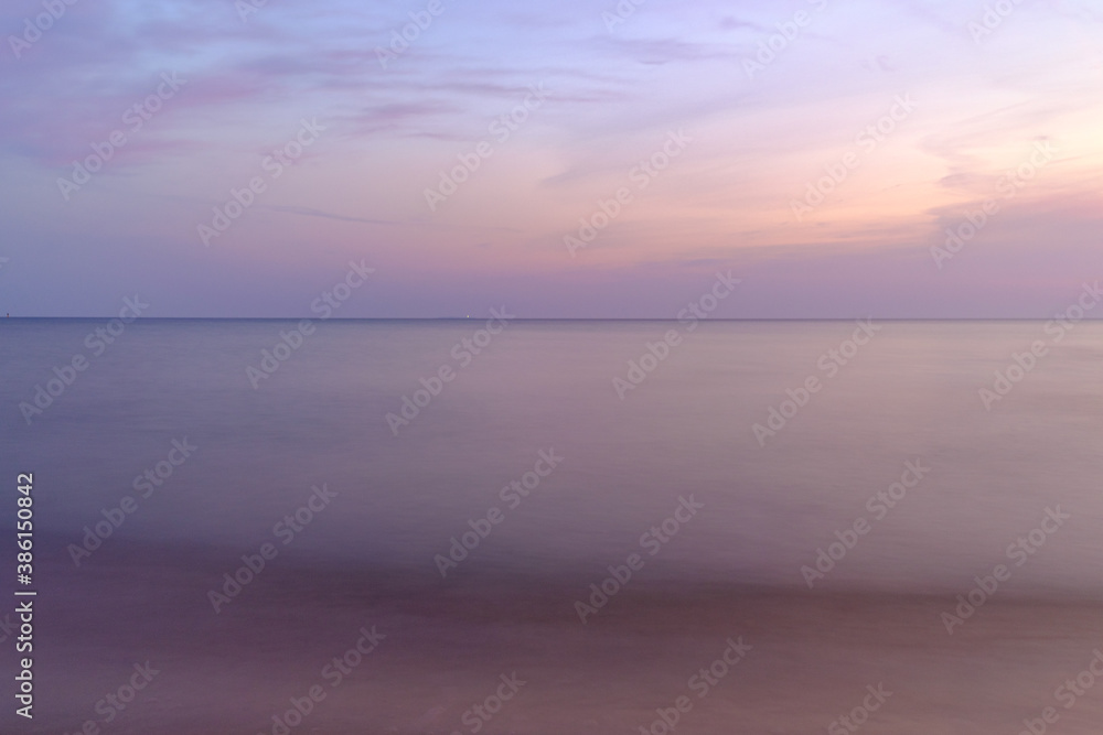 very calm and peaceful sunrise at the baltic sea in the morning