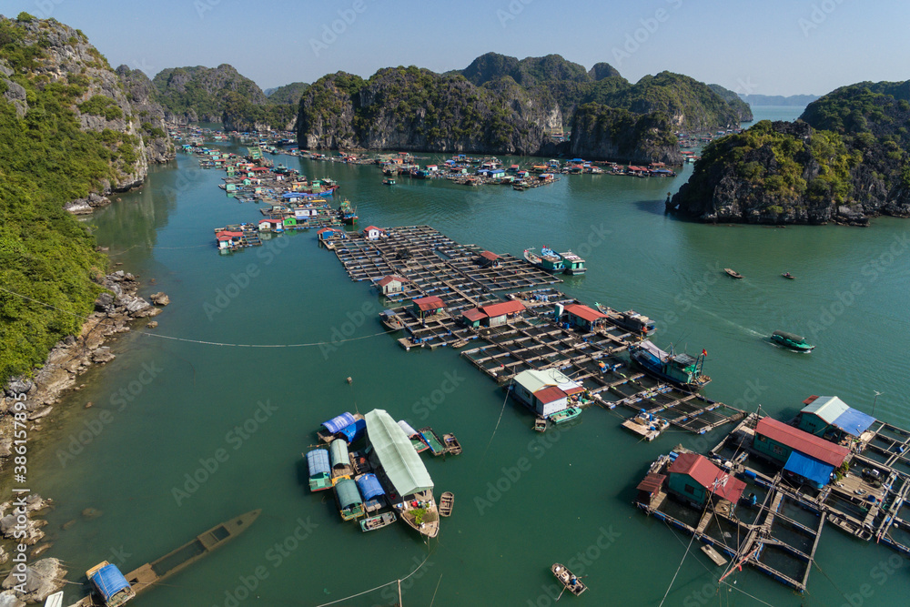 Floating Village on Ha Long Bay, Cat Ba Island, Vietnam, descending dragon bay Asia Aerial Drone Photo