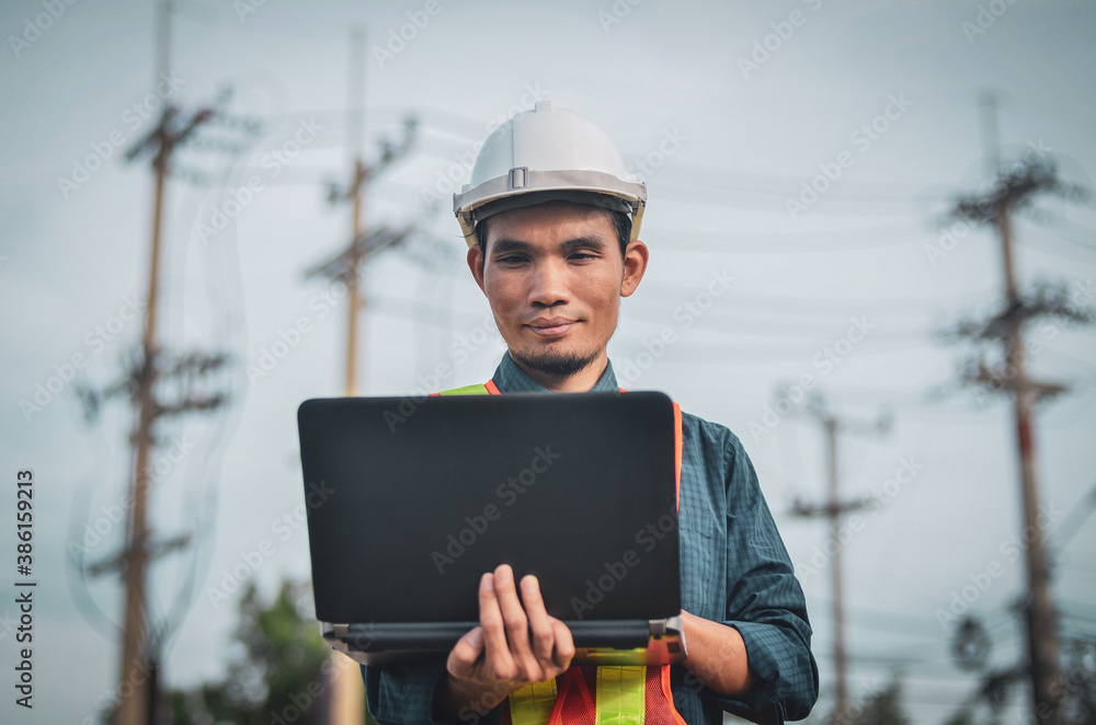 Electrical engineers use laptops at workplaces. Electrical engineers use laptops at workplaces.