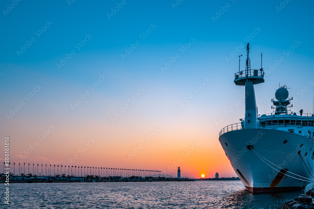 Fototapeta premium White lighthouse and urban architecture landscape night view
