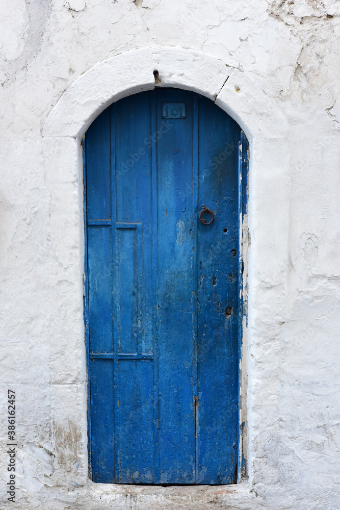 blue metal door in north african city
