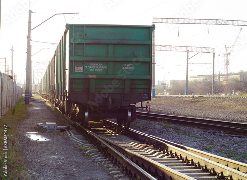 The last car of a departing train. Freight cars in a moving freight train. Transportation by rail. Russia. Krasnoyarsk. October 17, 2020