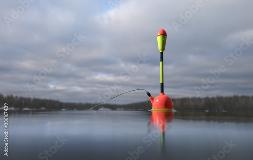 Fishing float in the lake close up. © Happyphotons