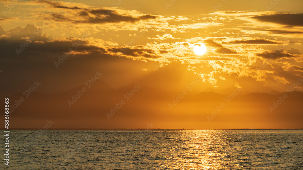 Fototapeta premium Kamchatka. Sunset in Avacha Bay with the reflections of the setting sun on the water