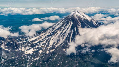 Kamchatka. Vilyuchinsky volcano in the clouds in summer. aerial photography