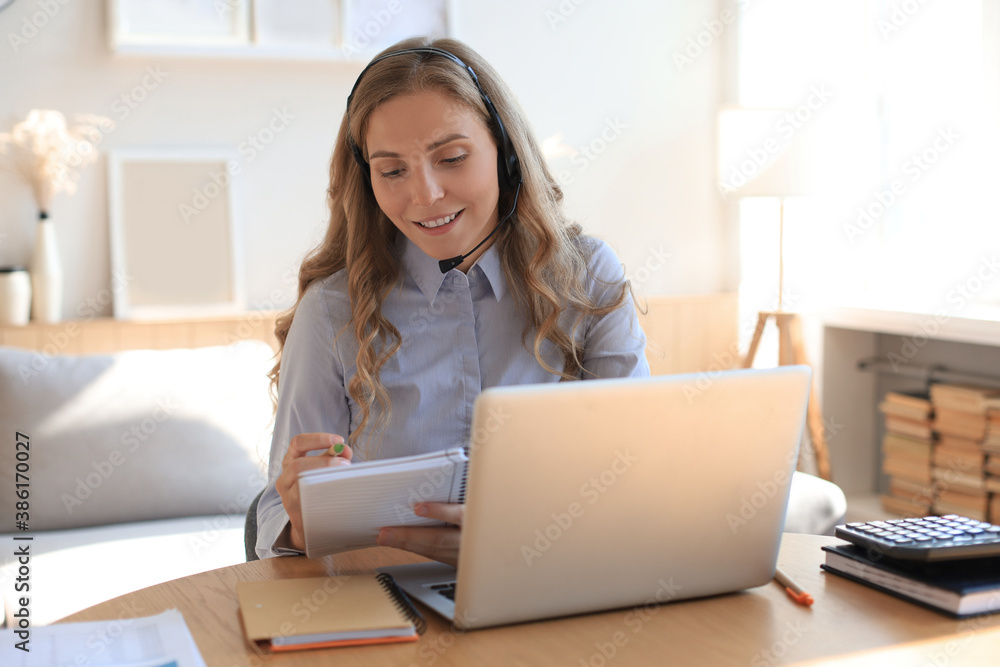 Freelance operator talking with headsets and consulting clients from home office. Freelance operator talking with headsets and consulting clients from home office.