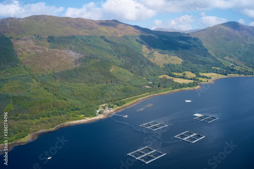 Fish farm salmon round nets in natural environment Loch Awe Arygll and Bute Scotland photo