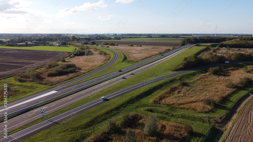 Motorway with few cars, near the exit of Fijnaart in Brabant south of the Netherlands in Europe.