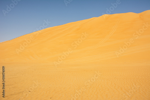 The view of the Moreeb Dune or Tal Moreeb sand dune located in proximity of Liwa Oasis at the Empty Quarter desert in the United Arab Emirates.
