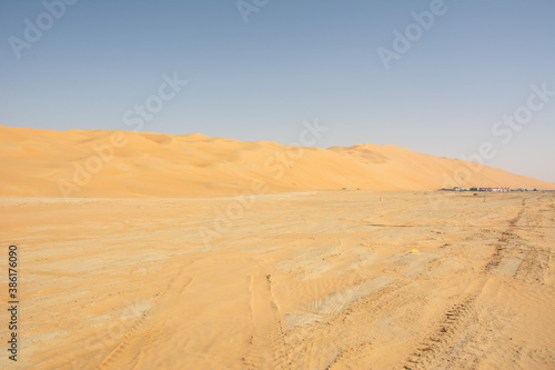 Fototapeta Naklejka Na Ścianę i Meble -  The view of the Moreeb Dune or Tal Moreeb sand dune located in proximity of Liwa Oasis at the Empty Quarter desert in the United Arab Emirates.