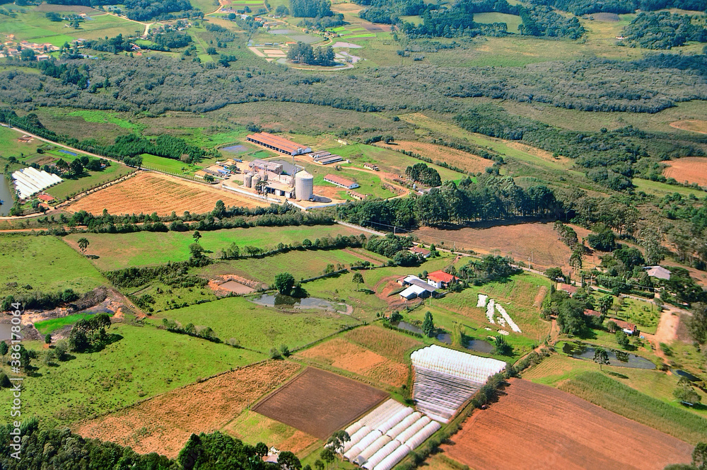 Aerial view of the sugarcane agricultural fields, in the agrobusiness, to produce sugar, ethanol and more, in the nearness of the Ribeirao Preto airport. São Paulo, Brazil. June 2014