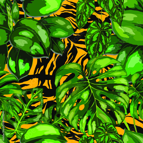 Tropical seamless pattern on animalistic texture. Jungle exotic summer print. Summer tropical leaf. Tropical flower fashion pattern. Floral tropic illustration. Vector seamless pattern.