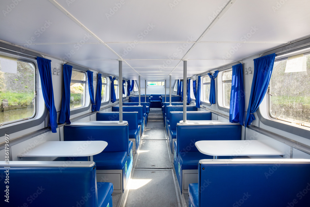 Obraz premium Generic passenger ship interior with tables and seats