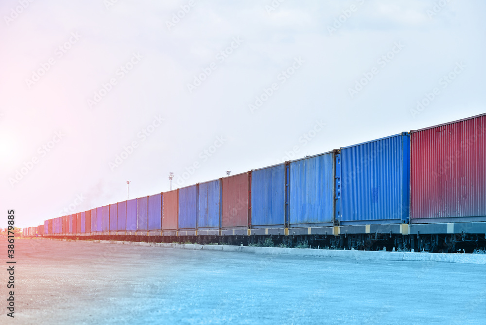 Fototapeta premium Freight Train with Cargo Containers on platform, Transport, Shipping import Export on blue sky background