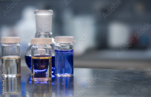 Chemicals in a science laboratory used for CBD oil analysis. Glass vials containing chemicals for analytical chemistry