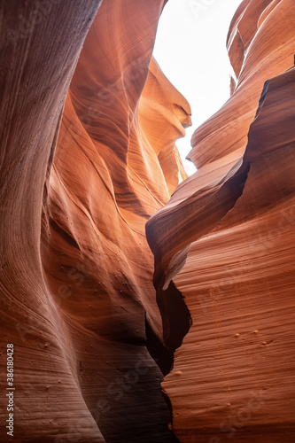 Famous Antelope canyon in daylight, mesmerizing rock curves. Vertical shot