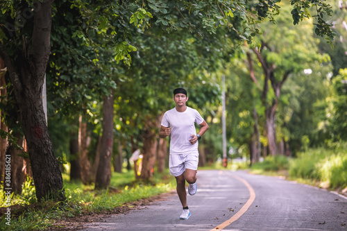 Slika na platnu Asian men jogging and running in the park