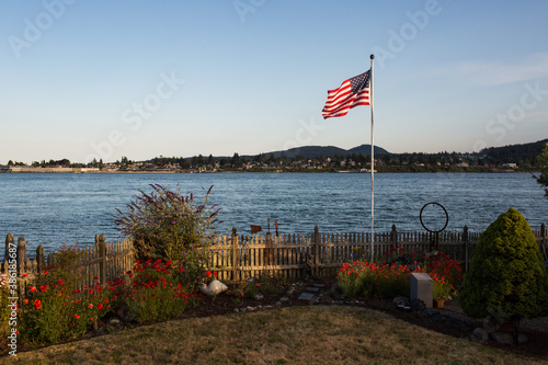 Beautiful beach house with american flag garden and lawn view