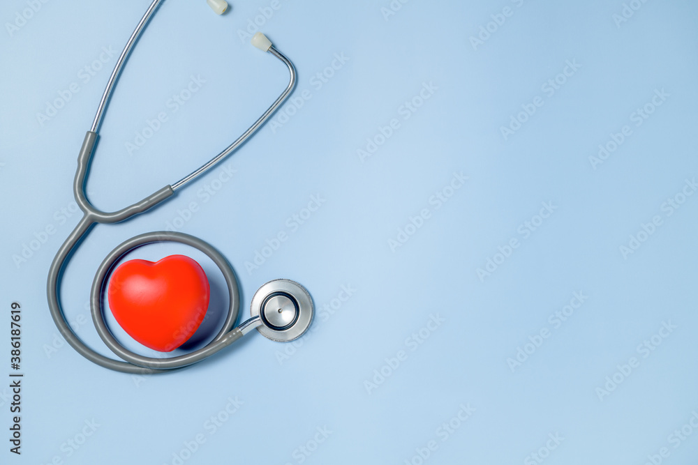 red heart and stethoscope isolated on blue background, red heart and stethoscope isolated on blue background,