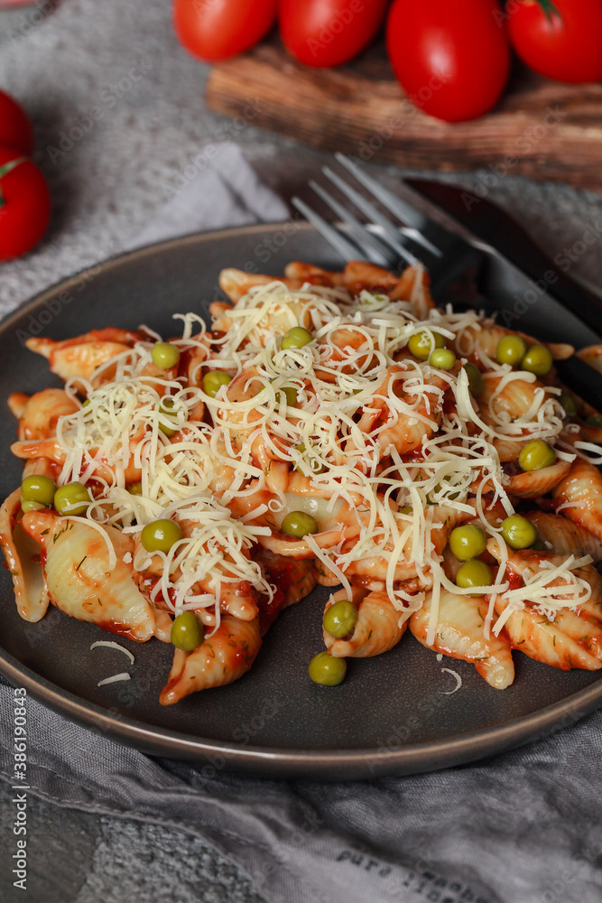 Pasta with cherry tomatoes, peas and Parmesan cheese. Homemade Italian pasta with tomatoes and sauce Pasta with cherry tomatoes, peas and Parmesan cheese. Homemade Italian pasta with tomatoes and sauce