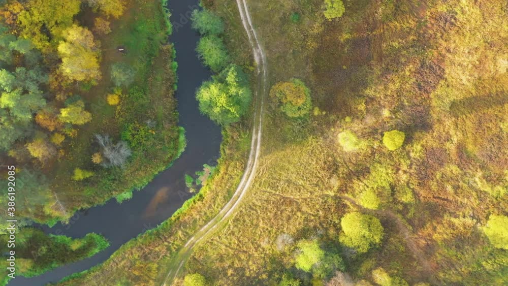 High Angle clockwise drone rotation above river, yellow forest and road, Nerskaya river, Moscow area, Russia High Angle clockwise drone rotation above river, yellow forest and road, Nerskaya river, Moscow area, Russia