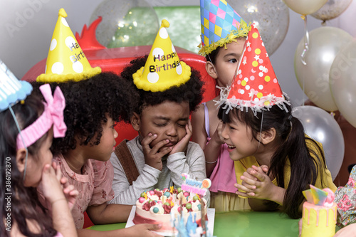 Photography Group of  happy joyful kids have fun celebrating her birthday with Multinational friend Kids birthday celebratiion party