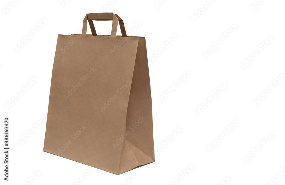 Brown package of paper on an isolated background with handles. Side view. Brown package of paper on an isolated background with handles. Side view.