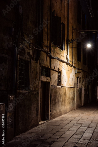 empty street at night in venice illumionated by street light