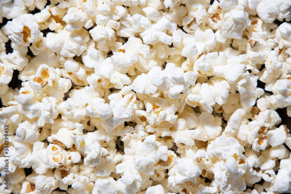 Scattered salted popcorn, texture background Scattered salted popcorn, texture background