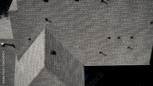 Top of a homeowners of a residence roof shingles photo