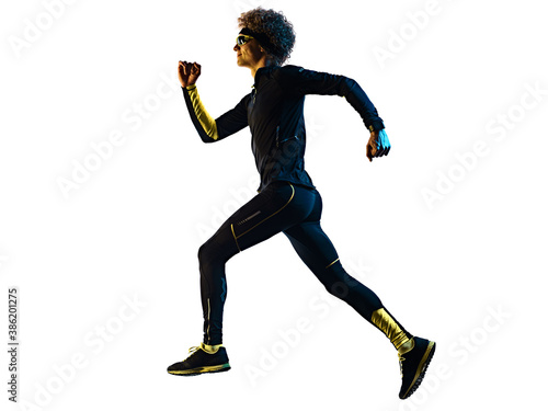 one youg caucasian runner jogger running jogging man in studio shadow silhouette isolated on white background