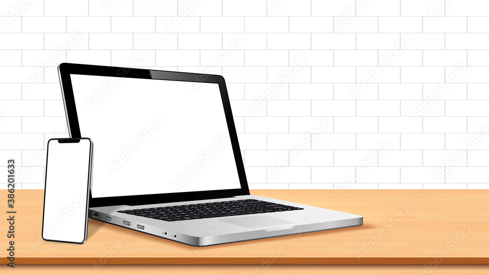 Fototapeta premium Laptop and smart phone with blank screen on table