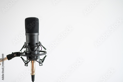 Professional microphone on a white background. Sound recording and broadcasting equipment