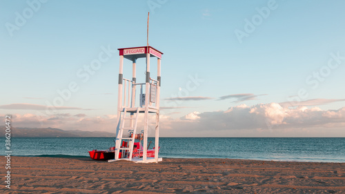 View of a lifeguard tower at the beach of Poetto at Sunset