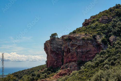 natural landscape of a rock mountain with blue sky in the background and white clouds