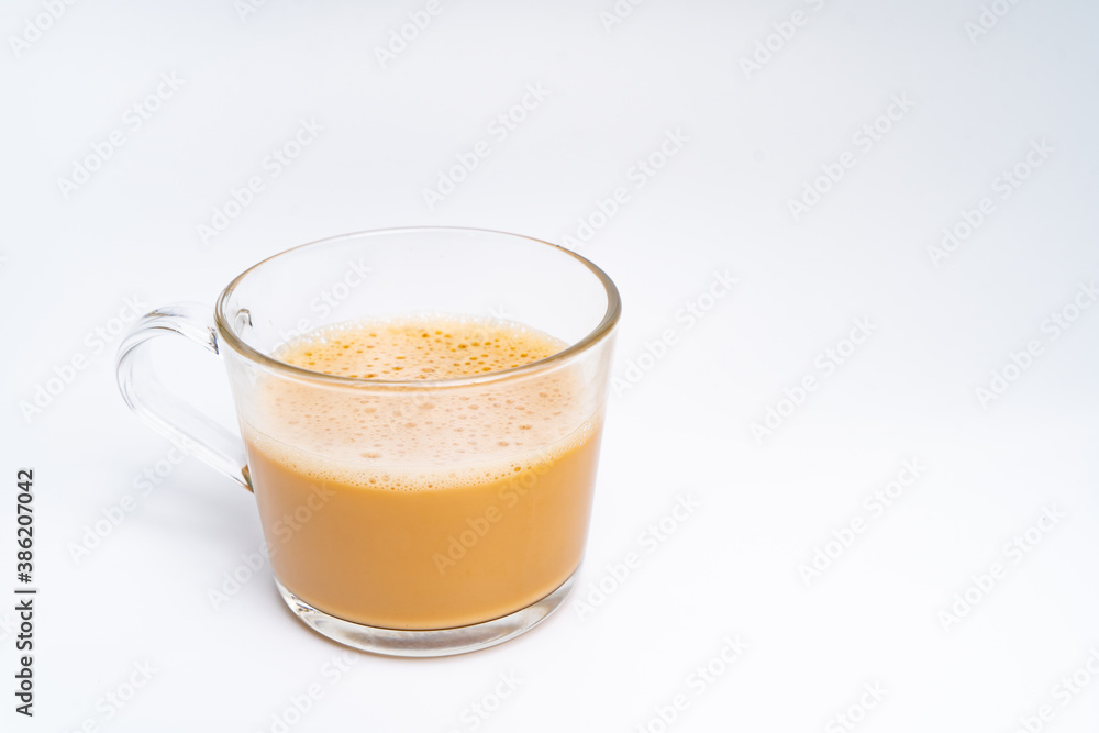 Milk tea or popularly known as The Tarik in Malaysia, isolated on the white background center of the frame Milk tea or popularly known as The Tarik in Malaysia, isolated on the white background center of the frame