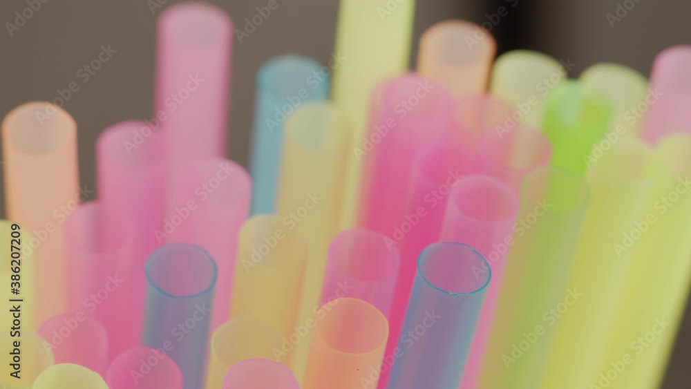Many plastic multicolored cocktail tubes, close-up, camera movement, rack focus Many plastic multicolored cocktail tubes, close-up, camera movement, rack focus