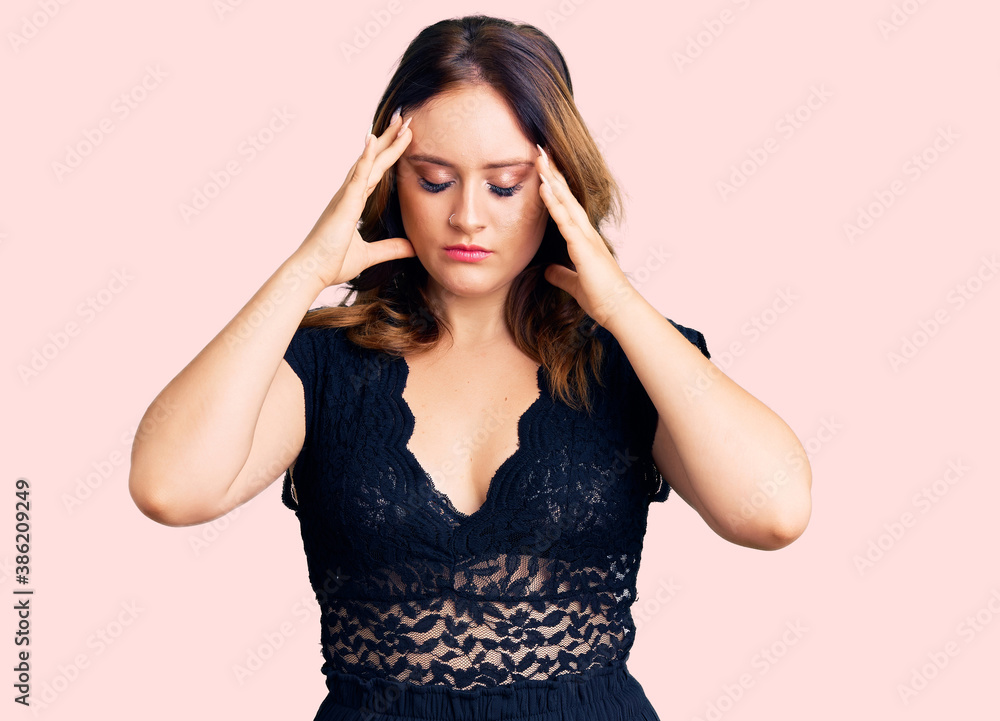 Young beautiful caucasian woman wearing elegant dress suffering from headache desperate and stressed because pain and migraine. hands on head. Young beautiful caucasian woman wearing elegant dress suffering from headache desperate and stressed because pain and migraine. hands on head.